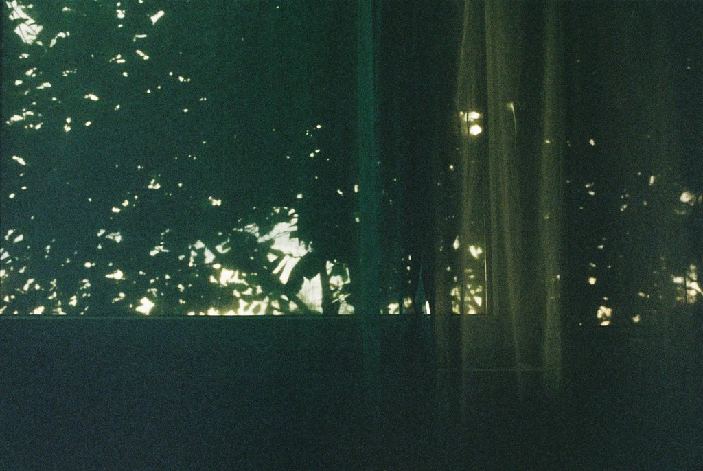Photograph of curtains in green light